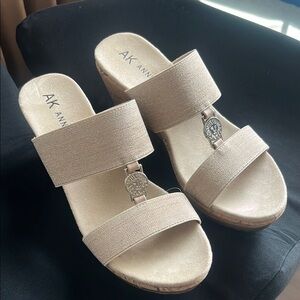 Anne Klein Cream Wedge Sandals with Minimalist Design
Never worn